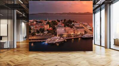 Zadar, Croatia - Aerial view of the Old Town of Zadar at dusk with mooring yachts, Cathedral of St. Anastasia and a dramatic golden summer sunset at background Wall mural