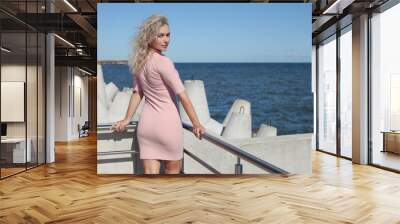 Portrait of the blond lady in a tight dress Wall mural