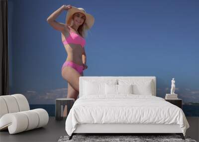 Summer vacation woman young girl in bikini Wall mural