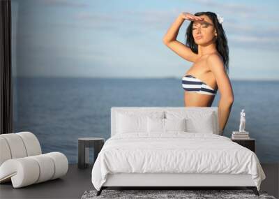 tanned girl with bikini on sea background Wall mural