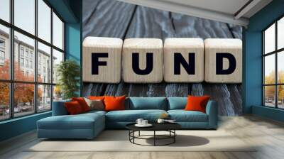 concept word fund on cubes on a dark wooden background Wall mural