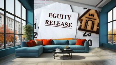 EGUITY RELEASE - words on white paper on the background of a house, pencil and calendar Wall mural