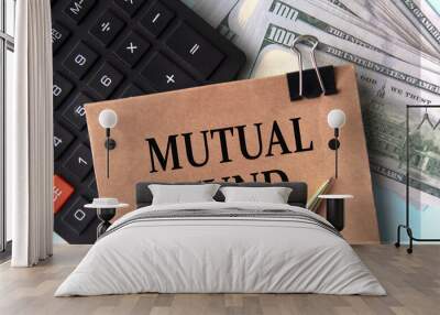 MUTUAL FUND - words on brown paper on the background of calculator and banknotes Wall mural