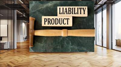 PRODUCT LIABILITY - words on wooden blocks on a green background with a judge's gavel Wall mural