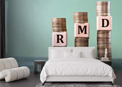 RMD - acronym on wooden cubes on stacks of coins Wall mural