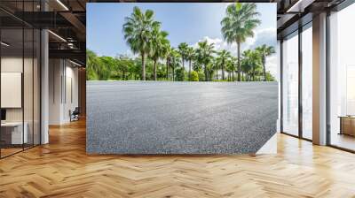 Asphalt road and tropical woods background Wall mural