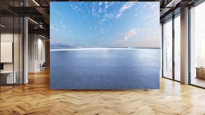 Empty brick floor and sunset clouds background Wall mural