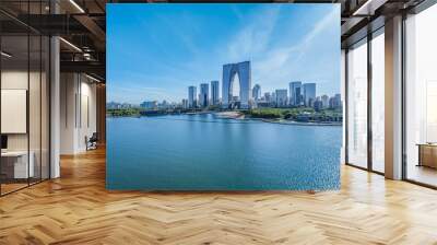 Modern city commercial buildings skyline and lake in Suzhou, China Wall mural