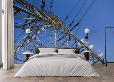 Pylon under the blue sky white clouds Wall mural