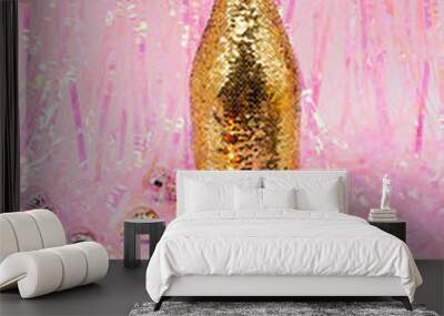 Champagne golden bottle with christmas balls. Trendy holiday composition. Wall mural