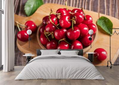 Ripe sweet cherries on wooden background Wall mural