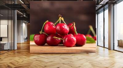 Ripe sweet cherries on wooden background Wall mural