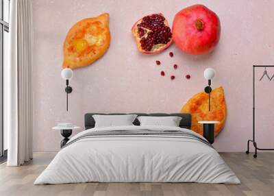 Caucasian cuisine. Georgian cuisine. Khachapuri with whole pomegranate and pomegranate seeds. Copy space. Wall mural