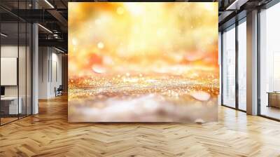 Abstract blurred background featuring golden light rays and sparkling glitter effects, showcasing a soft bokeh effect in warm yellow, white, and orange tones. Illuminated by sunlight, the scene create Wall mural