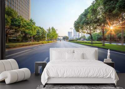 asphalt road of a modern city with skyscrapers as background Wall mural