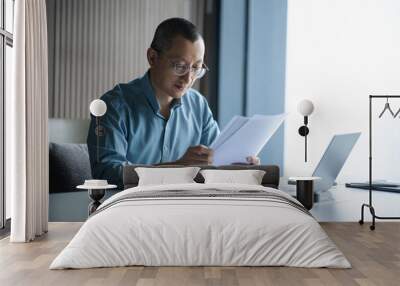 businessman looking document in office Wall mural