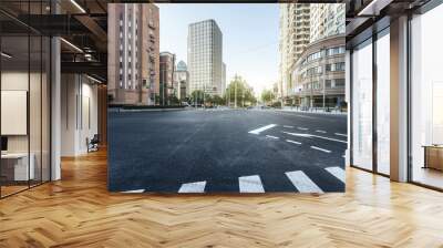 empty asphalt road of a modern city with skyscrapers Wall mural