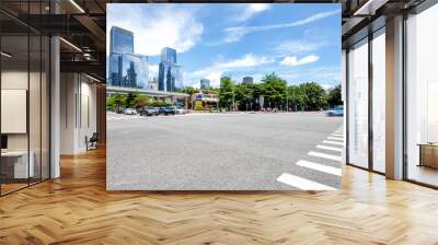 empty asphalt road of a modern city with skyscrapers Wall mural