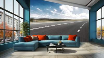 empty road and cityscape of modern city against cloud sky Wall mural