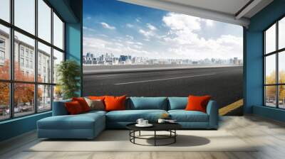 empty road and cityscape of modern city against cloud sky Wall mural