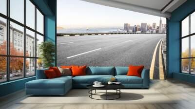 empty road with cityscape of modern city in blue sky Wall mural