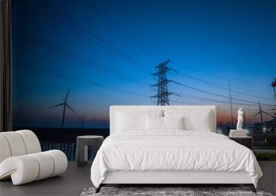 High voltage electric towers at sunset. Wall mural