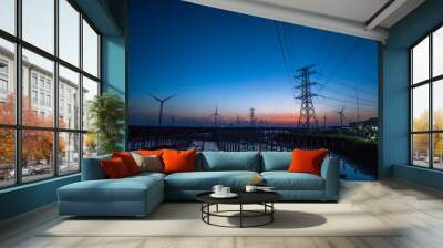 High voltage electric towers at sunset. Wall mural