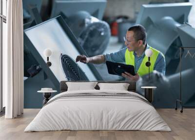 person working with tablet in workshop Wall mural