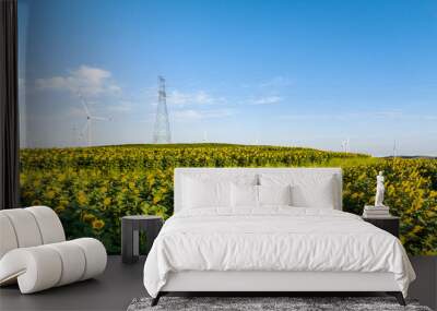 view of wind power turbine and pylon in field Wall mural