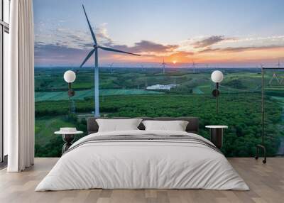 view of wind power turbine in field at sunset Wall mural