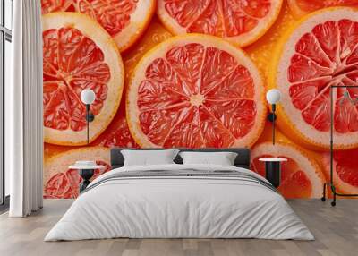 Close-up of Fresh Red Grapefruit Slices on Background Wall mural