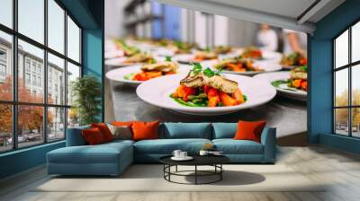 Cooking a delicious main course in the restaurant kitchen. Catering on holiday. Wall mural