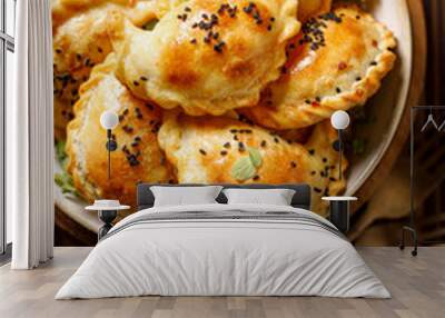 Baked dumplings (pierogi) with mushroom stuffing in a ceramic bowl on a wooden table, close-up view.  Vegetarian dish Wall mural