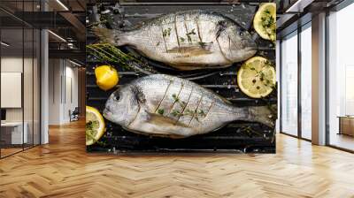 Fresh Dorada fish, sea bream with the addition of spices, herbs and lemon prepared for grilling on the grill barbecue, top view Wall mural