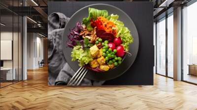 Fresh salad, Buddha bowl,  healthy and nutritious salad with a variety of vegetables, nuts and tofu cheese, top view. Balanced vegan meal,  healthy eating concept Wall mural