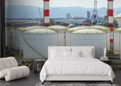 Many large round white reservoirs of chemical products in the port industrial terminal Wall mural