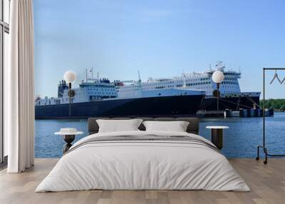 Two large cargo and passenger ferries moored in the harbor Wall mural