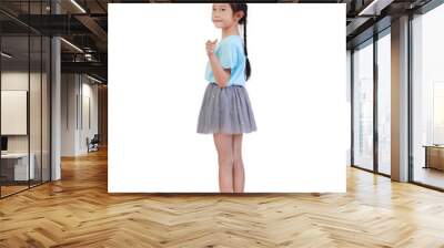 Asian little child girl with pigtail hair twisted necklace look back and pointing at camera isolated over white background. Full length Wall mural