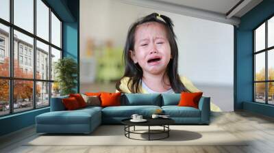 Close up Little kid girl crying with tearful on her face. Wall mural