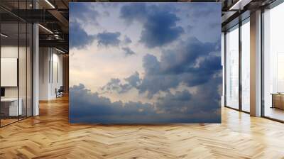 Dark clouds before rain on blue sky background. Wall mural