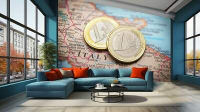 Closeup of Italy on a map and Euro coins Wall mural