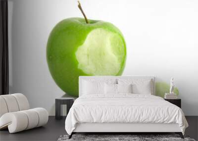 Green apple with bite taken out, on white Wall mural