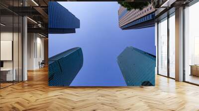 Modern skyscraper in Shanghai, with blue sky in the back. Wall mural