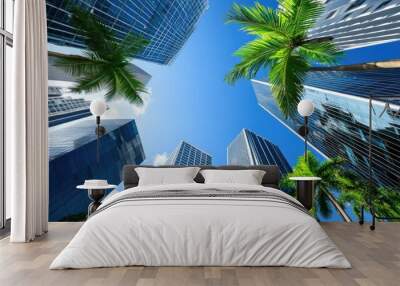 Tall glass and steel buildings tower over palm trees, showcasing a luxurious lifestyle amidst a vibrant blue sky in downtown Miami Wall mural