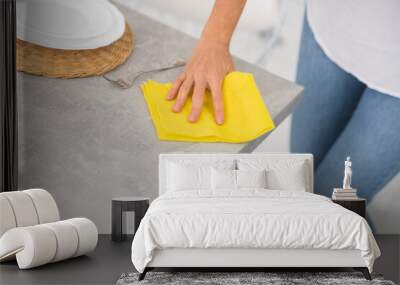 Close up of a housewife doing cleaning in the kitchen Wall mural