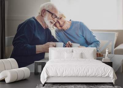 Delicious breakfast. Happy joyful couple smiling while having a meal together Wall mural