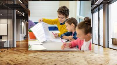 Generous boy sharing his test answers with the classmate Wall mural