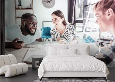 Happy foreigner speaking with his partners Wall mural