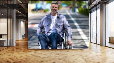 Happy middle aged handicapped man in wheelchair. Wall mural