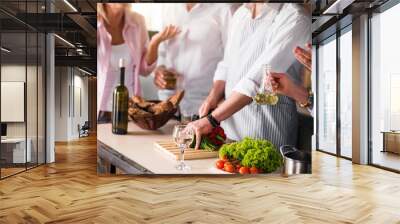 Image of family cooking healthy food together Wall mural